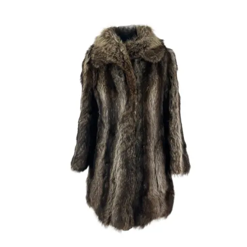 Stylish woman wearing a genuine raccoon fur jacket