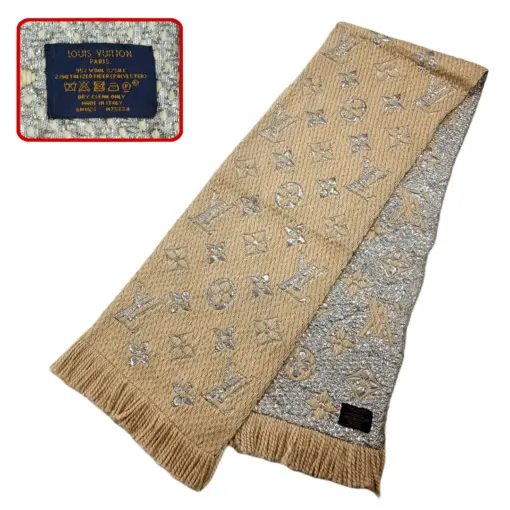 ouis Vuitton Beige Wool & Silk Logomania Shine Scarf, adding a touch of luxury to her outfit