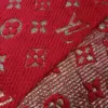 The Louis Vuitton Paris Stylish LV Red Wool Scarf styled in a chic knot