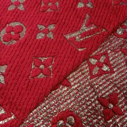 The Louis Vuitton Paris Stylish LV Red Wool Scarf styled in a chic knot