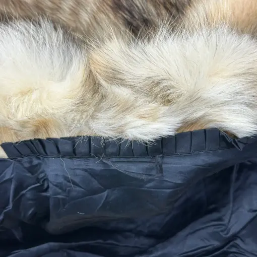 Fashionable ensemble featuring a vintage coyote fur coat