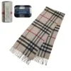 Vintage Burberry Beige Scarf made from 100% cashmere, showcasing classic British luxury. Pre-owned and in excellent condition.