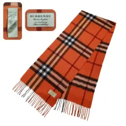 Vintage Burberry London 100% Cashmere Scarf in vibrant orange, draped elegantly