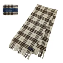 Burberry Vintage Beige Nova Check Cashmere Scarf showing classic beige color and iconic Nova Check pattern. 100% cashmere, made in England, with fringe accents and Burberry logo.