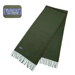 Luxurious green Burberry cashmere muffler scarf with embroidered logo and fringe accents.